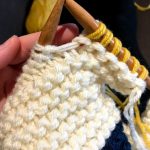 progress shot of hudson's bay blanket being knit